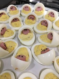 deviled eggs with pigs in them are ready to be cooked and put into the oven