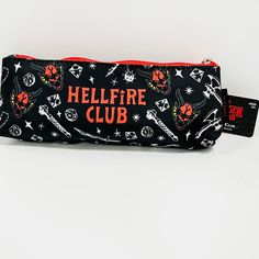 a black and red pencil case with hellfire club print on it's side