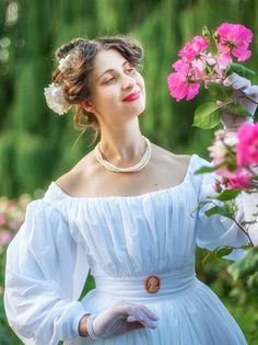 This lightweight batiste gown is your perfect choice for the late regency picnic or another Biedermeier period event. Sewn of the pure 100% cotton it has a lovely embroidered design on the bottom of the skirt. The bodice has a cotton lining and the back closure with hooks and bars. The proper bell-shape silhouette demands the period correct undergarments: corset and petticoats. Here you can find ones and order them separately or together with this gown: 1830s corset: https://www.etsy.com/listing Victorian Dress For Garden Party, Regency Picnic, 1830 Dress, White Victorian, 18th Century Fashion, Blue Gown, Wedding Summer, Historical Fashion, Embroidered Design