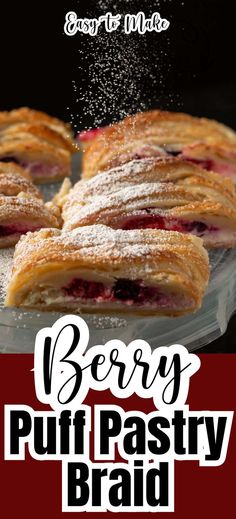 Berry puff pastry slices being dusted with powdered sugar.