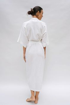 The Bali Robe, inspired by our founders' first trip to Bali, embodies our "bedroom to beach" concept. Crafted from lightweight fabric with a captivating texture reminiscent of rippled water. This versatile robe transitions seamlessly from home attire to beach cover-up, becoming a staple in your daily wardrobe. Drop Sleeve Relaxed fit Semi-sheer Midi length Tie waist belt Pockets White Relaxed Fit Cover-up For Loungewear, White Spring Kimono For Relaxation, Summer Wrap Robe For Lounging, Summer Relaxation Robe With Kimono Sleeves, Linen Wrap Robe For Beach, Summer Lounging Wrap Robe, Summer Wrap Robe For Relaxation, Linen Wrap Robe For The Beach, Summer Linen Lounging Robe