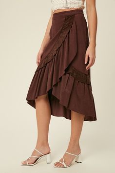 Introducing our Corduroy Wrap Skirt in Deep Plum - a must-have addition to your fall wardrobe. Crafted from soft corduroy, this mid-length skirt features a double-layered ruffle that adds volume and movement to your every step. The hi-low round hem adds a touch of playful elegance to this wrap style skirt. Ideal for any occasion, this skirt is perfect for pairing with your favorite boots and sweater. Our model is 5' 10" and wearing a size S. S 4/6M 8/10L 12/14 Corduroy Skirts, Gold Clothing, Cozy Dress, Mid Skirt, Gold Outfit, Deep Plum, Favorite Boots, Corduroy Skirt, Mid Length Skirts