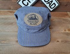 This listing is for one (1) adult train hat with faux leather laser engraved, personalized patch. This premium, personalized Adult Sized Train Hat is perfect for mom, dad, or grandpa. These "One Size Fits Most" adult hats match our best selling children's train hats and perfect for a family outing or for train loving grown ups. SIZING: Hats fit adult head circumference size from approximately 22.44" to 24" (57-61cm). Children's and youth hats are available under separate Etsy listing. ** Sample shown in listing photo is an example. Set will be personalized with the name you specify in the "Notes to Seller"/Personalization section of the order: 1. Please include name to be laser engraved on the patch 2. Patch will automatically come as shown in the listing photo with a steam train graphic a Train Engineer Costume, Train Conductor Costume, Engineer Costume, Birthday Party Adult, Train Costume, Train Graphic, Train Hat, Engineer Hat, Train Birthday Party