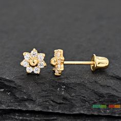 14K Gold Dainty Delicate Seven Petal Round CZ Flower Studs Screw Back Earring Girls Womens Children's Gift *Note: This listing is for One Pair of Stud earrings Metal: Solid 14K Yellow Gold Metal Stamp: 14K Finish: Polished Size: 4.3mm Stone Size: 1.5mm Gem Type: High-Quality Grade AAA CZ (Cubic Zirconia) Gem Shape: Round Gem Color: Clear CZ Setting: Casting Prong Setting Backing: Screw Back/ Safety Back *Nickel FREE* Perfect for Toddler, Baby, Babies, Kids, Children, Girls, Teens, Womens Perfect Gold Cluster Earrings With Flower Shape, Gold Flower Cluster Earrings With Prong Setting, Gold Flower-shaped Cluster Earrings With Prong Setting, Gold Cubic Zirconia Flower Cluster Earrings, Gold Flower-shaped Cluster Earrings With Cubic Zirconia, Gold Flower Cluster Earrings For Pierced Ears, Gold Flower-shaped Cubic Zirconia Cluster Earrings, Gold Flower-shaped Cubic Zirconia Earrings, Gold Flower Cluster Earrings