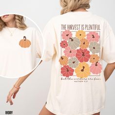 You will love our Comfort Colors fall Christian t-shirt for women. It is based on the Bible verse Matthew 9:37. This Comfort Colors tee comes in 6 beautiful fall colors, pepper, blue spruce, ivory, blossom, berry and denim. This is the perfect autumn top for any women to wear to fall festivals, the pumpkin patch or to a Thanksgiving gathering.   Comfort Colors T shirt Details: 100% ring-spun cotton Medium fabric (6.1 oz/yd² (206.8 g/m Relaxed fit Sewn-in twill label T shirt Care instructions: Ma Fall Tee Shirt Designs, Fall Christian Shirt Ideas, Christian Halloween Shirts, Christian Fall Shirts, Halloween T Shirt Design, Halloween T-shirt, Fall Tshirt Ideas, Fall Shirt Designs, Fall Shirts Vinyl