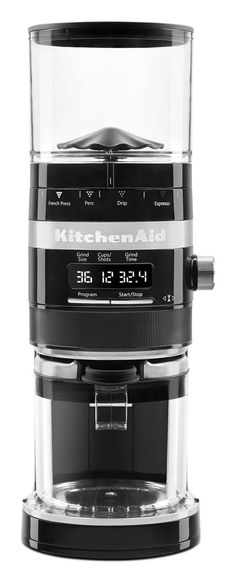 a coffee maker with a glass container on the top and an alarm clock in the bottom