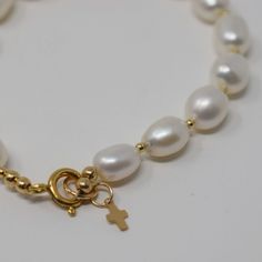 A simple, but meaningful bracelet perfect for celebration and encouragement "Let peace be in Thy strength" (Psalm 121:7). Materials - 8-9mm white baroque freshwater pearls, gold filled beads, clasp & cross charm SizeSmall (7 inches), Medium (7.5 inches), or Large (8 inches) ** All jewelry is meticulously handmade by me. Orders arrive gift wrapped ready for giving. Please allow 1-3 business days for production. Any questions? Email me at Sarah@milkvelvetpearls.com Spiritual Pearl Bracelet With 8mm Beads, Spiritual 8mm Pearl Beads Bracelet, Spiritual Pearl Bracelet With Pearl Charm, Spiritual Pearl Bracelet With Charm, Spiritual Pearl Bracelet, Hypoallergenic White Pearl Bracelet In 14k Gold Filled, Gold Spiritual Pearl Bracelet For Everyday Wear, Everyday Spiritual Gold Pearl Bracelet, Elegant Round Beads Bracelets For First Communion