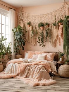 a bedroom with pink walls and plants hanging on the wall, bedding is made from natural materials