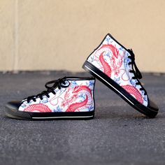 These Red Dragon Blue Ceramic Black high top canvas shoes are ideal for being unique and standing out from the rest of the crowd. To be Gnarly, you need to be different and feel different. These shoes will help you express yourself through the intricate art and gnarly design it displays. This unique shoe is hand drawn/designed in the USA and built with fantastic quality. CONSTRUCTION: Our shoes are very well constructed with quality stitching and a solid base. They are comfortable and durable and suitable for most occasions. HANDCRAFTED DESIGN: Wearing these shoes is making a statement. Our shoes have bold and gnarly designs that fit anyone who want to separate themselves from the rest. The designs are inspired by art and beauty from around the world. Exclusively designed in the USA. __FEA Streetwear Canvas Shoes With Red Sole, Casual High-top Canvas Shoes With Red Sole, Streetwear Ankle-high Canvas Shoes With Rubber Sole, Ankle-high Canvas Shoes For Streetwear With Rubber Sole, Ankle-high Canvas Shoes With Rubber Sole For Streetwear, Ankle-high Canvas Shoes For Streetwear, High-top Skate Shoes With Red Sole, Casual Custom High-top Sneakers With Red Sole, Casual Custom Sneakers With Red Sole Mid-top