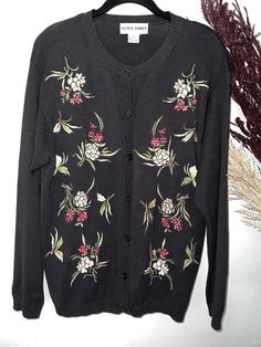 Absolutely gorgeous! Black button front cardigan with embroidered flowers. Made in Hong Kong. Easily dress it up or down for a unique and versatile wardrobe addition! Feel free to contact me with any questions and thanks thanks for looking. Casual Black Embroidered Cardigan, Black Retro Cotton Cardigan, V-neck Cardigan With Floral Embroidery For Winter, Black Cardigan With Floral Embroidery, Winter V-neck Cardigan With Floral Embroidery, Button Front Cardigan, Alfred Dunner, Floral Knit, Versatile Wardrobe