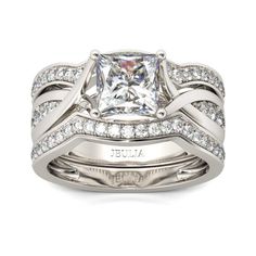 a princess cut diamond engagement ring set in white gold with matching wedding bands and band