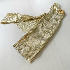 "There are gold gowns and then there are GOLD GOWNS! This amazing gold/white sequinned lame 80s gown is sooooo red carpet worthy! I mean, Oscar would approve! Condition: Excellent. I don't see any bald sequin patches but there's a lot of sequins so there may be one or two missing, Label: Only the care label remains Bust 31-33\" Waist 26-27\" Hips 35-36\" Length 53.5\" This item has been professionally dry cleaned and is ready to wear. Comes from a smoke and pet free home. Don't forget to follow Festive Gold Sequin Dress For Gala, Festive Floor-length Gold Sequin Dress, Glamorous Gold Festive Evening Dress, Gold Evening Dress For Holiday, Gold Sequin Evening Dress For Festive Occasions, Gold Sequined Evening Dress For Holiday, Gold Fitted Evening Dress For Festive Occasions, Festive Gold Sequined Evening Dress, Festive Gold Fitted Evening Dress