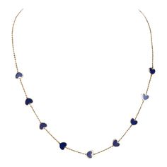 A chic way to add a pop of blue and "heart" to your neck stack. Nine blue lapis hearts with gold chain in between makes it a perfect necklace for layering or to wear on it's own. It's also great for gifting!  lapis; 16-18 inches  Exact dimensions are unknown. Please reach out in the seller Q&A for any questions on measurements. Blue 14k Gold Heart Pendant Jewelry, Blue Dainty Necklace With Heart Charm, Dainty Blue Necklace With Heart Charm, Blue 14k Gold Necklace With Adjustable Chain, Blue 14k Gold Cable Chain Jewelry, 14k Gold Necklace With Blue Adjustable Chain, Blue Dainty Jewelry With Cable Chain, Blue Dainty Cable Chain Jewelry, Blue Dainty Chain Necklace With Delicate Chain