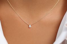 "Pear Shaped Diamond Necklace/ 14K Gold Pear Shape Diamond Choker Necklace/ Pear Shape Diamond Necklace / Black Friday Item Details * Made to Order. * Gold Kt: 14K (Please message me if you want 18K) * Custom Gold Color: Rose Gold, Yellow Gold, White Gold * Pear Shape Diamond: 1 pc 5.5 x 3.5MM * Total Number of Stones: 1 * Total CTW: 0.23 Ctw * Diamond Color-Clarity: G Color Si Clarity * Setting Type: Prong * Ready to Ship in 7-10 Business Days If you have any additional questions about this pro White Gold Necklace With Single Pear-shaped Diamond, Pear-shaped White Gold Necklace With Single Diamond, White Gold Pear-shaped Necklace With Diamond, White Gold Pear-shaped Single Diamond Necklace, Pear-shaped Single Diamond White Gold Jewelry, Dainty Pear-shaped White Gold Necklace, Pear-shaped White Gold Jewelry With Single Diamond, White Gold 14k Pear-shaped Necklace, White Gold Pear-shaped 14k Gold Necklace