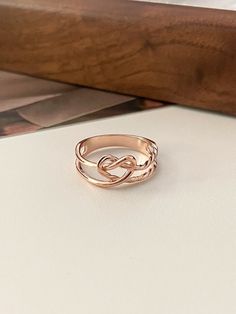 a gold ring sitting on top of a table