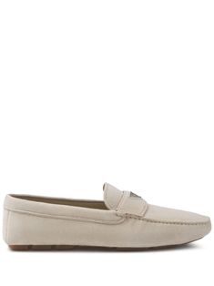 light grey suede enamel triangle logo slip-on style round toe branded leather insole flat rubber sole Classic Beige Suede Flats, Classic Suede Slip-ons With Flat Heel, Classic Suede Flat Slip-ons, Modern Flat Loafers With Branded Insole, Designer Suede Loafers With Flat Heel, Modern Slip-on Loafers With Suede Lining, Classic Suede Flat Sneakers, Classic Suede Sneakers With Flat Heel, Classic Flat Suede Slip-ons