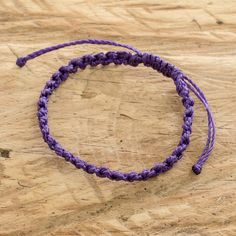 Whether you wear it alone or mix it with other bracelets, this macrame wristband is a fun casual accessory. Carmina Giron in Guatemala crafts the adjustable bracelet from waxed polyester cord. Cheap Adjustable Macrame Braided Bracelets, Adjustable Purple Braided Bracelets For The Beach, Handmade Adjustable Nylon Thread Bracelets, Handmade Adjustable Nylon Thread Bracelet, Casual Nylon Thread Bracelets As Gift, Adjustable Sliding Knot Nylon Thread Bracelets, Handmade Adjustable Friendship Bracelets In Nylon, Resizable Braided Nylon Cord Bracelets For Festivals, Casual Purple Bracelets With Sliding Knot