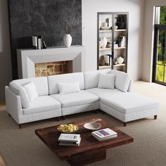 a living room with a large white sectional couch