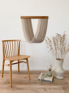 two wooden chairs sitting next to each other on top of a hard wood floor