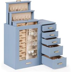 a blue jewelry box with five drawers and several necklaces in it's compartments