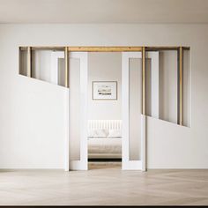 an empty room with white walls and wooden floors