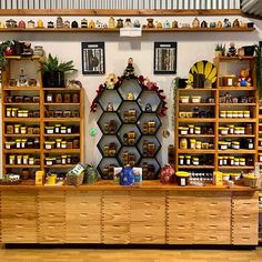 the shelves are full of honey jars and other items on display in the store's shop