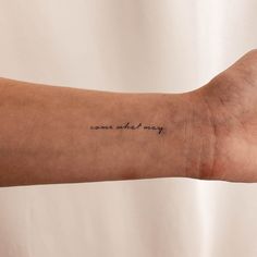 a person's arm with a tattoo that reads, come and may