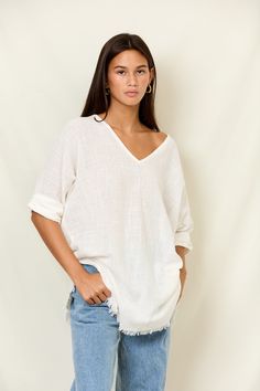 Our Elna Mini Caftan is your classic ready-to-wear resort piece. This light breezy style is made from 100% cotton gauze. A V-neck mini, Elna is the cropped version of our Zane Caftan and can be worn as a tunic, an effortless top tucked into jeans or shorts, and of course over swim as a coverup! Clothing Themes, Chic Top, Roll Up Sleeves, Sleeve Designs, Hat Hairstyles, Resort Wear, Roll Up, Dresses For Sale, Open Shoulder Tops