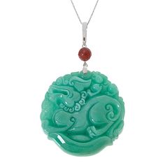 Kwan Collections Carved Jade Dragon Pendant with 18" Chain  Celebrate the Chinese Year of the Dragon with this expertly-carved green jade dragon pendant. Dragons represent strength and good luck in many eastern cultures. This pretty piece features a faceted red jade accent, silver enhancer bail and includes an 18" chain necklace.        Pendant approx. 3-1/8"L x 2"W     Chain approx. 18"L x 1/16"W with 2" extender     Stamped .925     Enhancer bail     Round green jade pendant has carved dragon design     Carved piece topped with round, faceted red jade bead accent     Comes with rope chain necklace; spring ring clasp   Stone Information       All sizes and weights approximate     Color-Enhanced Green Jade - Round carved (50mm)     Color-Enhanced Red Jade - Faceted bead (8mm) Traditional Engraved Jade Necklace, Traditional Jade Medallion Jewelry, Traditional Jade Necklace With Round Pendant, Green Carved Amulet Necklace, Green Carved Round Pendant Jewelry, Engraved Jade Pendant Jewelry, Carved Jade Pendant Jewelry, Carved Jade Pendant Necklace, Carved Silver Jade Necklace