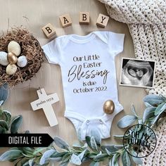 a baby's bodysuit with the words our little easter blessing is coming on it