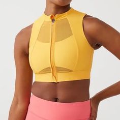 Recycled Nylon Jersey And Mesh Sport Bra. Paneled Construction Round Neck Zip Closure Elasticized Hem Logo Bonded At Side Seam Cutout At Back Hook-Eye Fastening At Back Waist Supplier Color: Mango Body: 78% Recycled Nylon, 22% Elastane. Trim: 81% Nylon, 19% Spandex. Made In Turkey. 222487f561018 Yellow Stretch Sports Bra, Yellow Breathable Activewear For Sports, Yellow Stretch Sports Bra Athleisure, Yellow Stretch Sleeveless Sports Bra, Sporty Yellow Racerback Activewear, Yellow Stretch Sleeveless Activewear, Yellow Sleeveless Activewear For Training, Yellow Sleeveless Stretch Sports Bra, Yellow Stretch Racerback Activewear