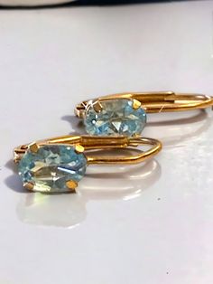 BEAUTIFUL Vintage 10k Yellow Gold Oval Blue Topaz Lever Back Earrings! * Gorgeous pierced earrings in solid 10k yellow Gold, each earring has an oval Blue topaz stone! * In beautiful pre-loved condition! * Weigh .8 grams * Very Pretty, would make a great gift! Ships FAST and FREE, fully insured and in a gift box. I guarantee item to be as described and pictured so please shop with confidence : ) Blue Oval Topaz Earrings, Gold Oval Blue Topaz Earrings, Classic Gold Earrings With Blue Topaz, Oval Topaz Earrings For Gift, Oval Topaz Earrings As Gift, Blue Oval 14k Gold Earrings, Oval Gold Topaz Earrings, Oval Blue 14k Gold Earrings, Oval Topaz Earrings For Anniversary