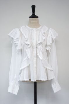 Uber stylish loose fit long sleeve cotton embroidered blouse with ruffle detail front and back. Model is in MINUSEY ONE SIZE. Please allow 5-12 days shipping when in restocking. * MINUSEY ONE SIZE = EU 34-38, US 2-6* 100% Cotton* Dry clean* Made in Korea - Model Height: 170cm/5'7" (US2, EU34) White Cotton Blouse With Ruffles, Cotton Ruffled Lantern Sleeve Blouse, Cotton Blouse With Ruffles And Lantern Sleeves, White Ruffled Blouse For Fall, Fall White Ruffled Blouse, White Ruffled Lantern Sleeve Top, Back Model, Cotton Blouse, Cotton Blouses