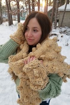 Whimsical oversized bobble scarf knitting pattern. Blanket scarf knitting pattern. This is a fun project made with super bulky yarn. It knits up fast on large-sized needles. Matching fingerless glove pattern is included in one size. Techniques used include knitting, purling, and making bobbles. Fringe can be applied as well. Designed to keep you warm and cozy this winter!

#womensoversizedscarfknittingpattern #indieknits #giftforher #blanketscarfknittingpattern #bobbleknitting #handmade #DIY Fingerless Glove Pattern, Fingerless Gloves Knitted Pattern, Scarf Knitting Pattern, Glove Pattern, Gloves Pattern, Scarf Knitting, Winter Boho, Scarf Women Fashion, Fingerless Gloves Knitted