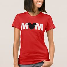 a woman wearing a red shirt with the word mom printed on it