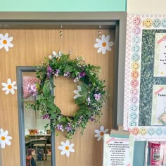 a door with a wreath and flowers on it