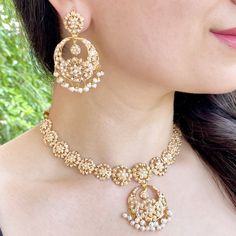 Featuring an all pearl jadau necklace with a delicate floral design made in 22ct gold. This necklace weighs 32.56 GMs including 1.25 GMs of hanging pearls and these earrings weigh 21.55 GMs including 1.95 GMs of hanging pearls Price Breakup Summary Component Rupees % of Total 22k Gold 241,783 75.2% Stones & Beads 26,710 8.3% Making Charges 43,521 13.5% Taxes (GST) 9,360 3.0% Total 321,373 100.0% View Detailed Price Breakup 22k Gold Jewelry With Matching Earrings For Diwali, Temple Jewelry In Yellow Gold With Pearls, Elegant Round Kundan Necklace For Eid, Elegant Kundan Necklace For Eid, Yellow Gold Pearl Temple Jewelry, 22k Gold Temple Jewelry For Eid, Yellow Gold Meenakari Jewelry For Reception, Traditional Jewelry Sets With Pearl Drop For Reception, Pearl Drop Jewelry For Diwali Reception