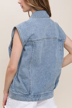 DetailsA denim vest featuring a boxy fit, collar, and functional pockets 100% cotton Sleeveless Denim Blue Top For Work, Sleeveless Cotton Denim Top For Work, Sleeveless Cotton Denim Vest With Pockets, Dark Wash Denim Vest With Pockets And Relaxed Fit, Casual Sleeveless Denim Blue Jacket, Trendy Sleeveless Vest With Pockets, Casual Cotton Denim Vest With Pockets, Casual Sleeveless Denim Blue Denim Jacket, Casual Sleeveless Denim Vest With Pockets