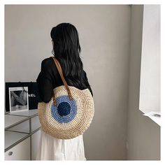 In stock fast shipping from Los Angeles! The Elena Handbags Boho Round Beach Straw Tote is the perfect accessory to elevate your summer style. Handcrafted with eco-friendly woven straw, this stunning boho shoulder bag is sure to make a statement whether you're beach-going, yoga-practicing or running everyday errands. Carry your essentials in style with this chic and sustainable tote. Size: 44cm in diameter (17in) Designer Style ID: 8465 Boho Round Beach Woven Bag, Handmade Straw Woven Shoulder B Trendy Braided Jute Beach Bag, Bohemian Handwoven Bags For Vacation, Bohemian Handwoven Shoulder Bag For Vacation, Braided Shoulder Bag For Beach, Trendy Braided Shoulder Bag For Vacation, Bohemian Woven Bag For Day Out, Bohemian Woven Bags For Vacation, Casual Braided Shoulder Bag For Vacation, Trendy Jute Straw Bag For Day Out