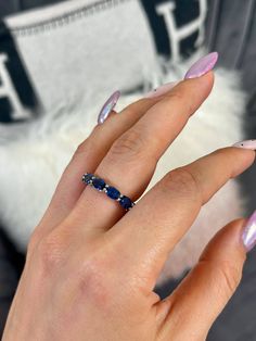 "Details: * Handmade item *Materials: 14k White Gold/ Natural Blue Sapphire Gemstone *Natural Gemstone: Blue Sapphire *Gem color: Royal Blue *Band color: White Gold *Condition: Never been Used; Made to order DESCRIPTION: 💎 Welcome to the Our Shop, Congratulations 🍾 on discovering us. 💎 The Royal Blue Sapphire eternity band from our \"Gem Candy Collection\" is a breathtaking display of elegant design and high-quality gemstones. The quality of the material is second to none and the stones are o Sapphire Ring Band, Oval Diamond-cut Lab-created Sapphire Ring, Oval Diamond Cut Eternity Band, Sapphire Eternity Band Gift, Oval Eternity Band With Prong Setting For Promise, Oval Lab-created Sapphire Ring With Diamond Cut, Sapphire Gemstone Eternity Band, Oval Diamond Cut Eternity Band Gift, Oval Diamond Cut Eternity Band As Gift