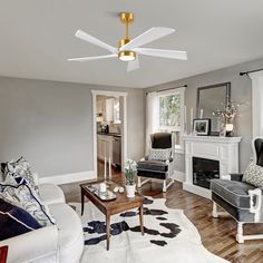 a living room filled with furniture and a fire place