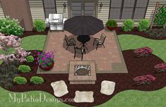 an outdoor patio and fire pit in the middle of a yard with chairs, table and umbrella