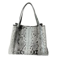 This is a new tote bag by Raviani. It is made in natural color python leather leather. This bag is fully lined with many zipper pockets, center pocket & 2 hidden pockets. This bag has top zipper closure, also has flap with magnetic snap. This bag can be made in many colors. Please contact us Measurements: 17'' W x 13'' H x 8'' D Luxury Snake Print Bag For Everyday Use, Luxury Snake Print Shoulder Bag For Everyday, Everyday Use Top Handle Shoulder Bag With Snake Print, Everyday Snake Print Satchel Bag, Leather Tote Bag With Snake Print, Snake Print Shoulder Bag For Everyday Use, Chic Snake Print Shoulder Bag For Everyday Use, Leather Tote Shoulder Bag With Snake Print, Leather Snake Print Tote Shoulder Bag