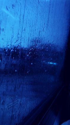 rain drops on the window of a bus