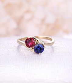 Ruby engagement ring Sapphire engagement ring 14K rose Gold vintage rings woman Wedding Unique Jewelry birthstone Anniversary gift for her All our diamonds are 100% natural and not clarity enhanced or treated in anyway. We only use conflict-free diamonds and gemstones. - Vintage style Ruby and moonstone ring - Natural Conflict free diamonds - comfortable band Lab Ruby Size: 6mm Lab Sapphire Size: 6mm Side sotnes: Natural diamond Weight - approx 0.02CT*3 Clarity - VS-SI Color- H/white Cut - VG - Ruby And Sapphire Engagement Ring, Round Cut Ruby Ring With Accent Stones For Anniversary, Valentine's Day Anniversary Ruby Ring, Luxury Promise Ring With Prong Setting And Round Cut, Promise Ring With Round Cut Prong-set Birthstone, Round Cut Birthstone Ring With Prong Setting For Promise, Anniversary Ruby Ring Solitaire Round Cut, Anniversary Couple Rings With Cubic Zirconia, Anniversary Couple Rings With Prong Setting