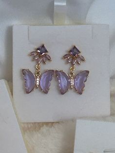 14k gold purple butterfly earrings, clip-on stud earrings ,birthday gift for her, bridesmaid gift ,engagement gift, Christmas gifts. - let your jewelry tell them your story, tell them about your elegance. - these earrings feature eye-catching. -the latest touch to your charming and elegance. -BEAUTIFL gift IDEAL FOR (Valentine's Day, Christmas gifts, mothers gift day, Bridal, Wedding, Bridesmaids, Mother of the Bride, Easter gift, Holidays) or ANY Special Occasions. -Lightweight and easy to wear Purple Butterfly Earrings, Butterfly Necklace Gold, Earrings Clip, Wedding Jewelry Earrings, Gold Butterfly, Purple Butterfly, Birthday Gift For Her, Butterfly Necklace, Butterfly Earrings