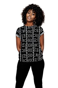 This Tribal Women T-shirt features an authentic African black and white print, perfect for adding a unique touch to any outfit. Made with high-quality material, it offers comfortable wear and stylish design for the modern woman. Celebrate cultural diversity with this one-of-a-kind T-shirt. Product Features Please Compare your Measurements To our Size Chart This T-shirt is Designed for fashionable women. Made from 5.47 Oz. 100% polyester. Double-needle hemmed sleeves and bottom. Vivid print that Print On Shirts, Indoor Outdoor Bathroom, Cultural Diversity, Black And White Print, Skirt Leggings, Women T Shirt, Stylish Design, Modern Woman, Timeless Pieces