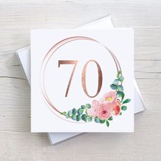 an 70th birthday card with pink flowers and greenery