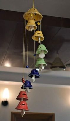 a group of bells hanging from the ceiling