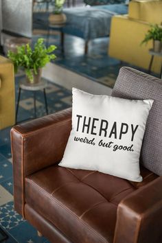 a couch with a pillow that says therapy works out good